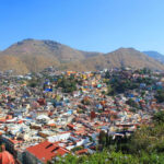 A view of Guanajuato, Mexico from El Pipila, showcasing the colorful buildings and mountainous landscape.