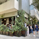 Exterior of Lardo restaurant in Mexico City with a crowd waiting outside.