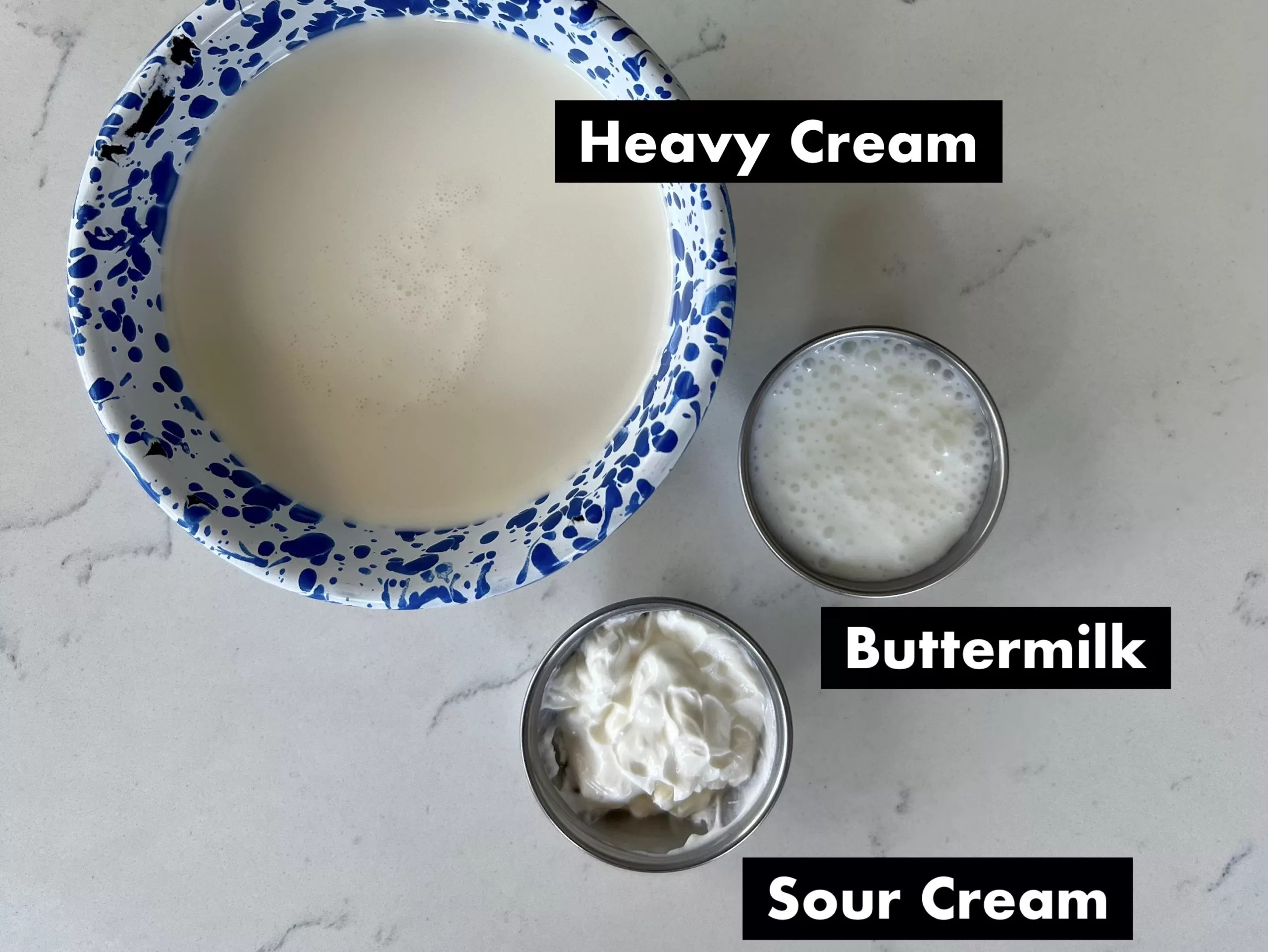 ingredients measured out to make homemade crema mexicana including sour cream, heavy cream and buttermilk