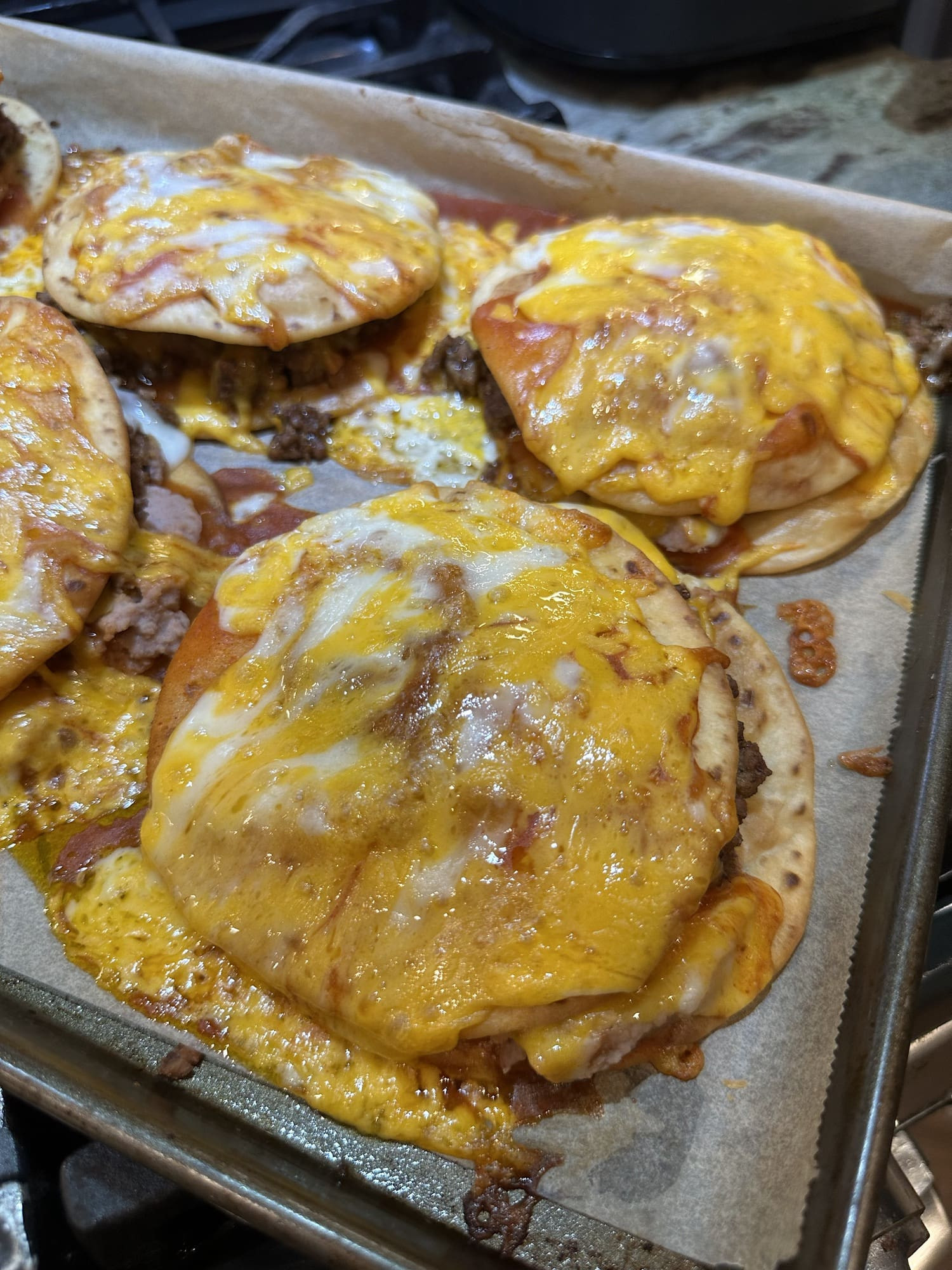 Baked Taco Bell Mexican Pizza with melted and bubbly cheese, ready to be served and enjoyed.