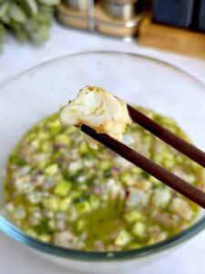 Close-up of marinated shrimp, showing the color change from translucent to opaque as it &quot;cooks&quot; in the lime juice.