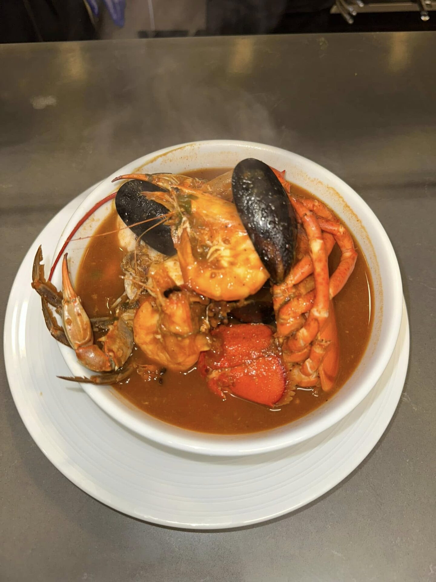Hearty seafood soup bowl at La Playita mexican seafood restaurant