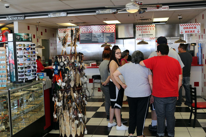 Crowded Laguna Burger location in New Mexico, illustrating its popularity and the long lines of burger enthusiasts.