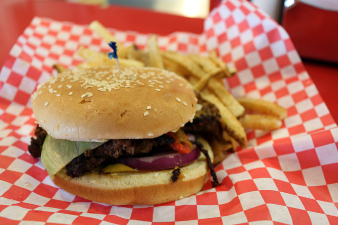 The world-famous Laguna Burger paired with golden French fries, a must-try meal in New Mexico.