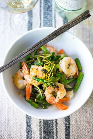 Image of Shrimp Asparagus Stir Fry with Lemon and Basil, a healthy and quick skillet meal.