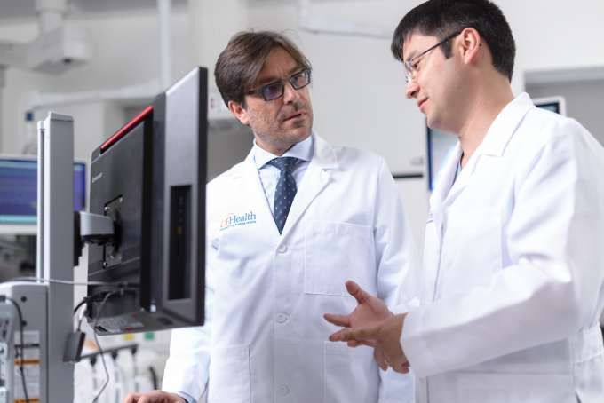 Thoracic surgeons discussing patient outcomes after lung transplant