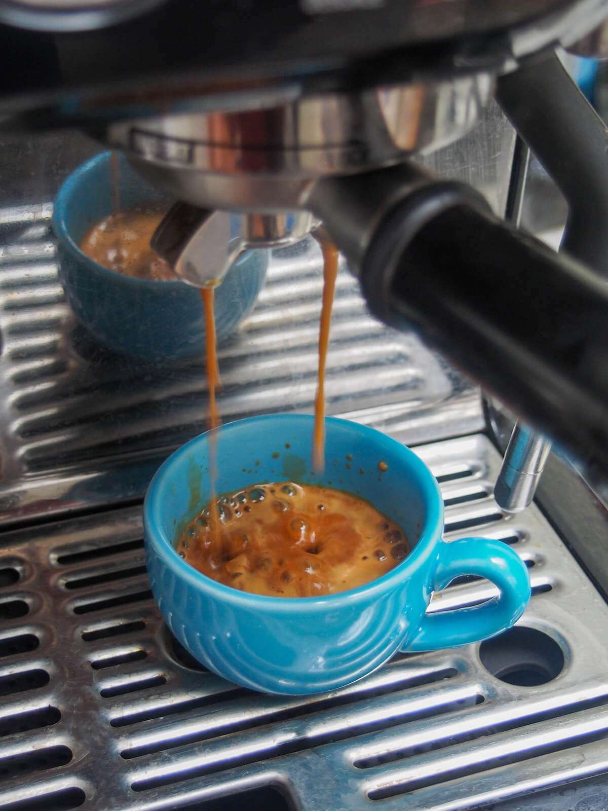 Preparing espresso for a Mexican carajillo, showcasing the fresh coffee being brewed.