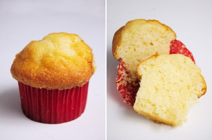 A Mantecada pan dulce, highlighting its muffin shape and red paper wrapper.