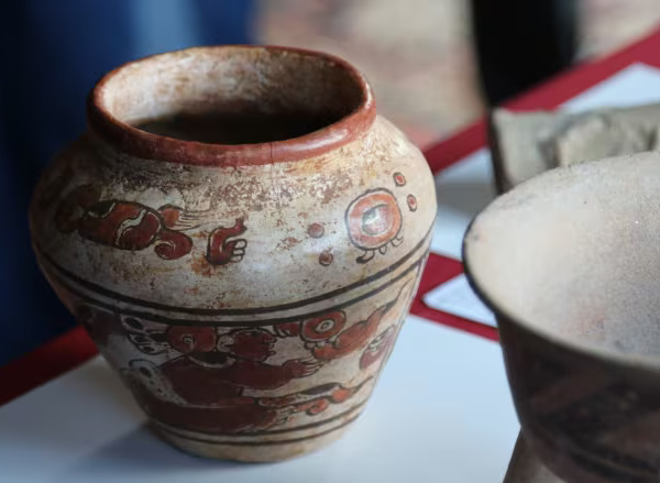 2000-year-old Mayan vase on display at the Mexican Cultural Institute after being returned from a thrift store find.