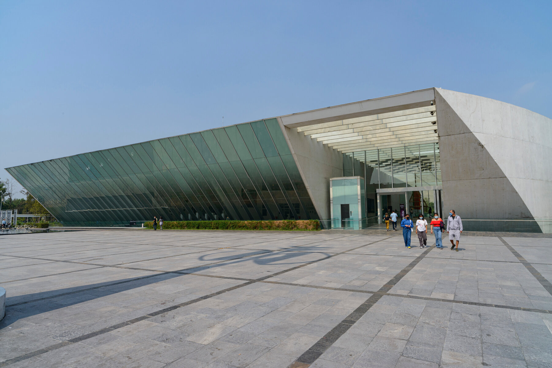 Exterior of MUAC museum at UNAM, featuring modern architecture and glass facade