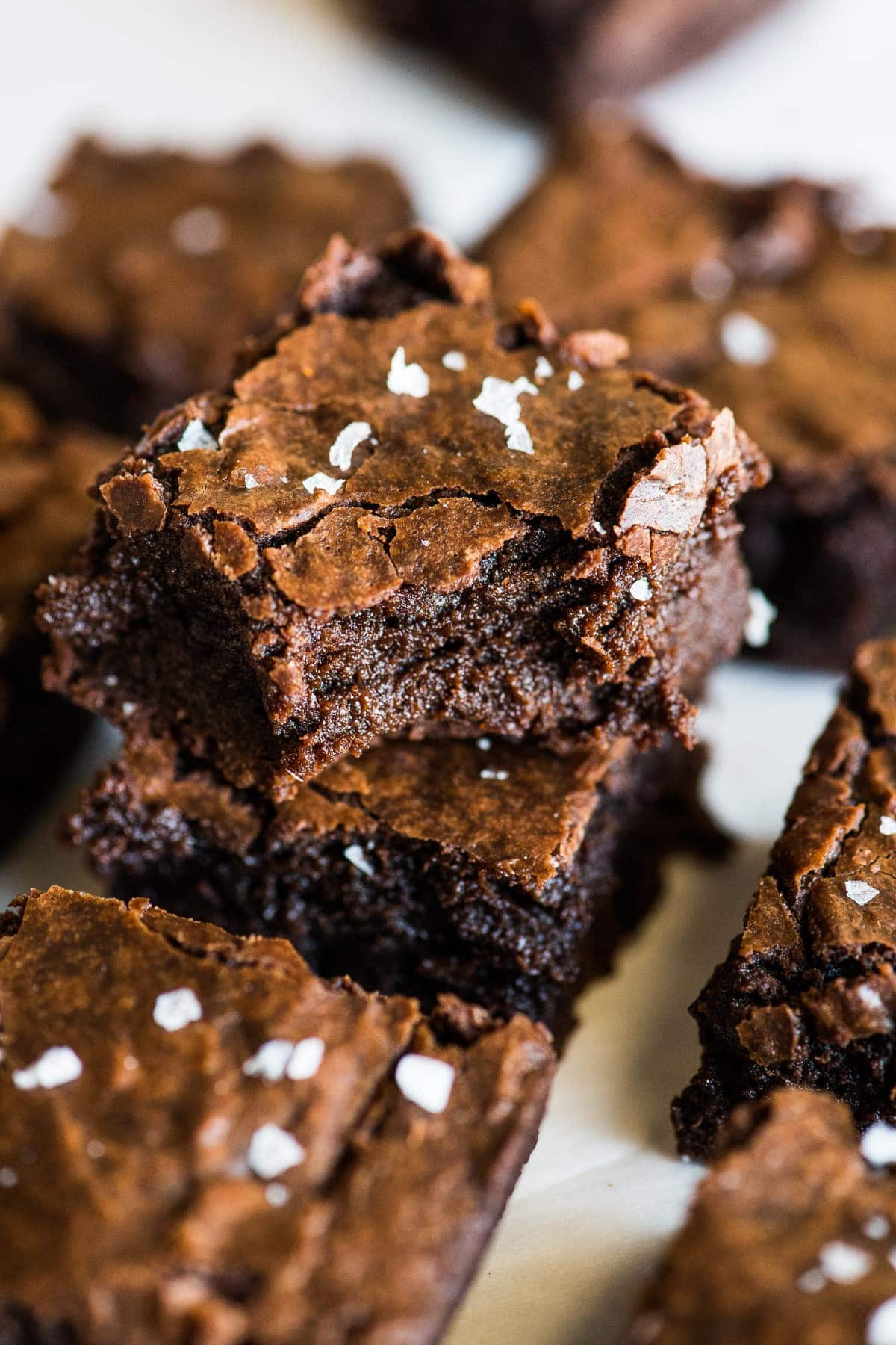 A close-up shot of a Mexican brownie, showcasing its fudgy texture and a sprinkle of flaky salt.