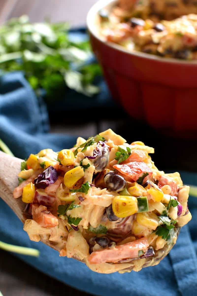 Close-up shot of creamy Mexican Coleslaw with visible black beans, corn, and bell peppers, highlighting its fresh and flavorful ingredients.