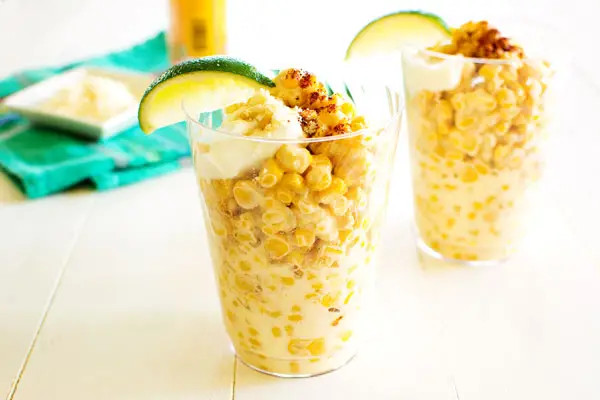 Fresh corn kernels being prepared for esquites.