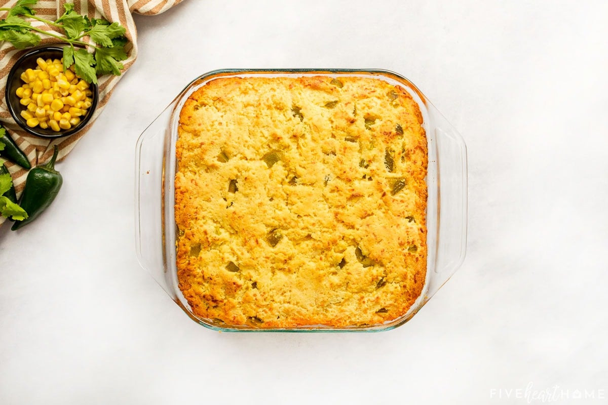 Freshly baked Mexican Cornbread Casserole, golden brown and bubbly, straight from the oven.