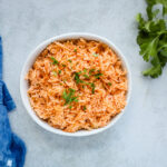 Bowl of fluffy Mexican rice, showcasing its vibrant color and inviting texture