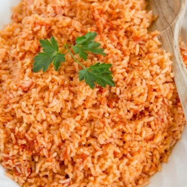 Close-up shot of flavorful Mexican Rice in a bowl, highlighting its texture and color