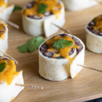 Close-up of vibrant Mexican Pinwheels featuring black beans and cheese, perfect as vegetarian Mexican food horderves.