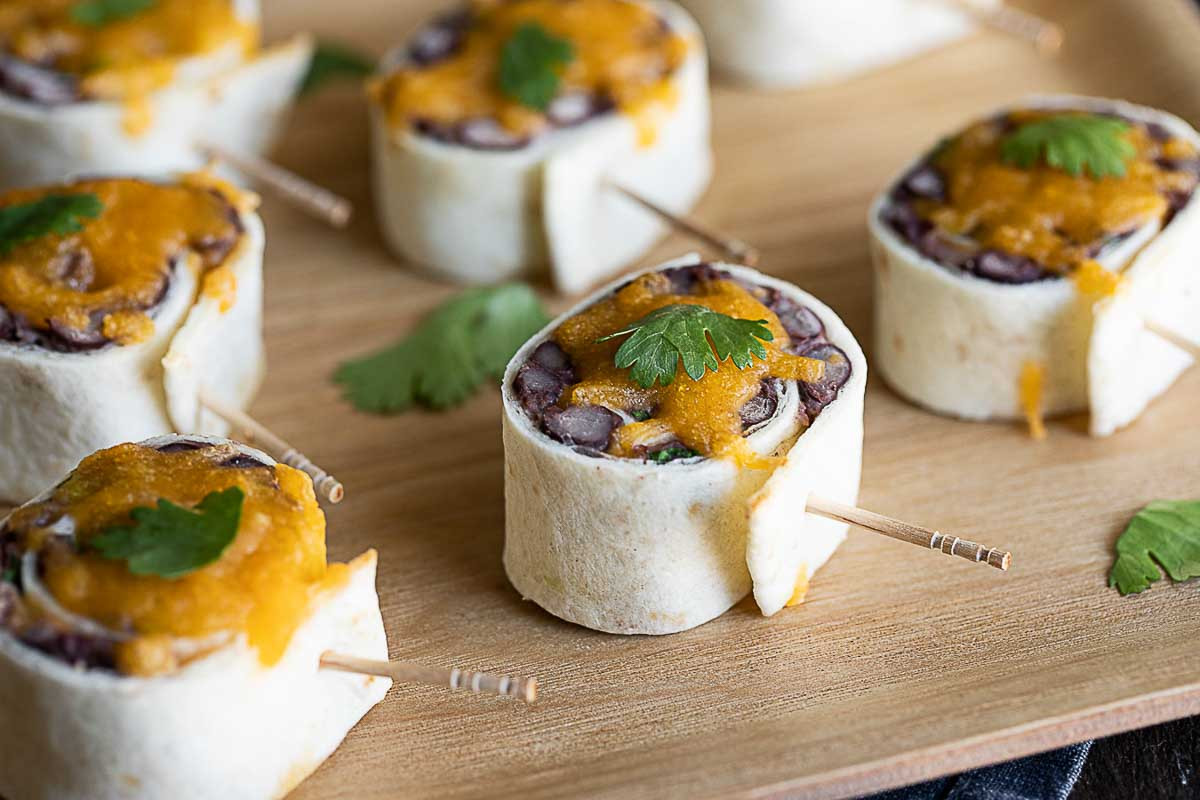 Close-up of vibrant Mexican Pinwheels featuring black beans and cheese, perfect as vegetarian Mexican food horderves.