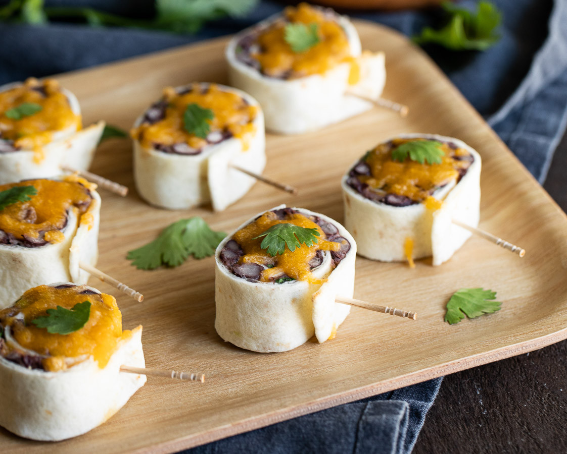 Overhead shot of Mexican Pinwheels arranged on a platter, highlighting their vibrant colors and inviting presentation as cold Mexican food horderves.