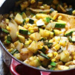 Delicious and vibrant vegetable side dish for Mexican cuisine featuring zucchini, corn, and poblano peppers.