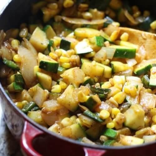 A vibrant mix of Mexican veggies including zucchini, corn, poblano peppers, and onion, perfect as a side dish or filling.