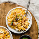 A beautifully plated serving of Mexican Street Corn Casserole, showcasing its creamy texture and vibrant colors.