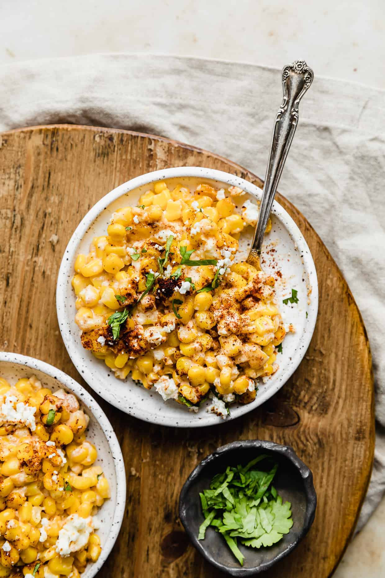 A beautifully plated serving of Mexican Street Corn Casserole, showcasing its creamy texture and vibrant colors.