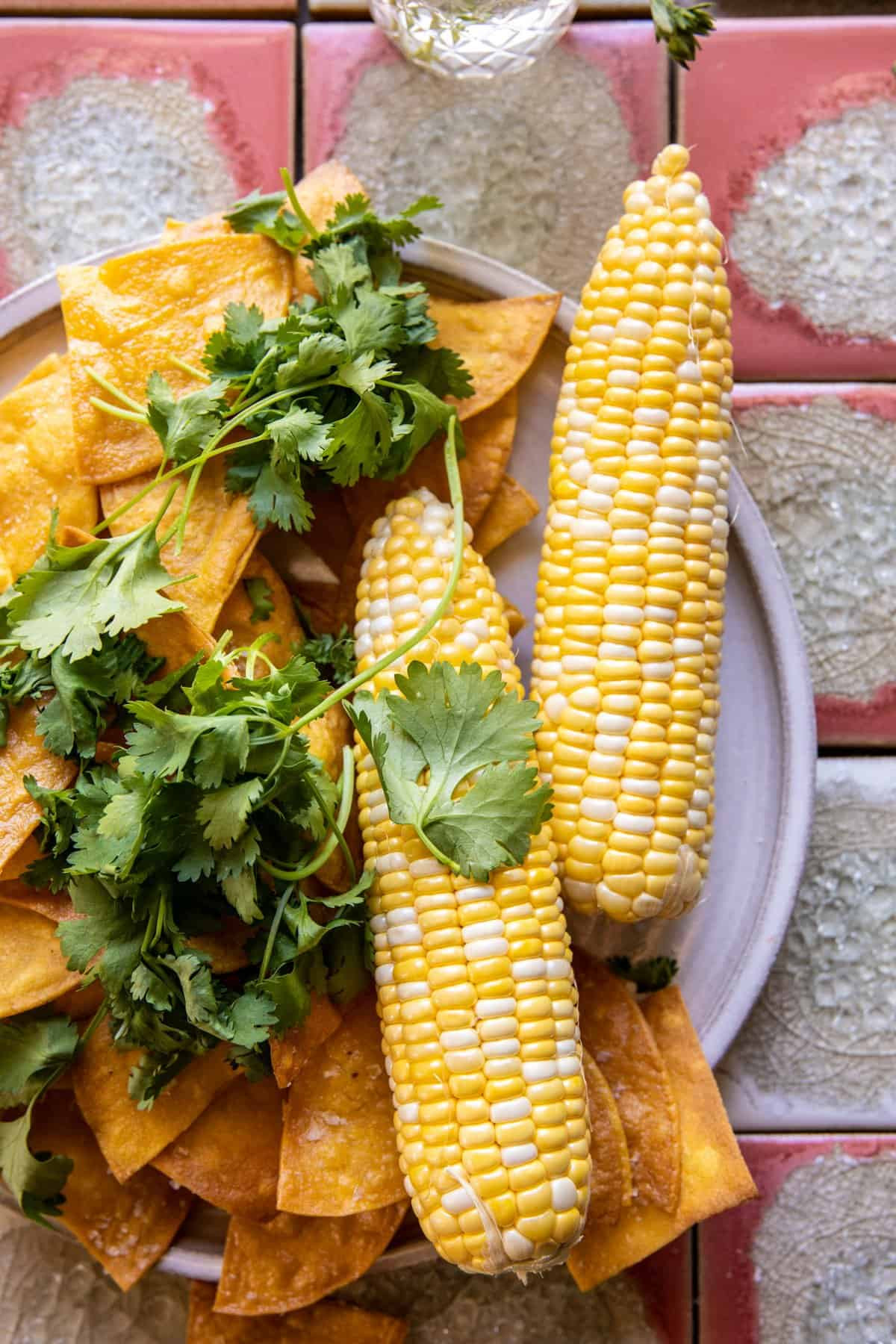 Bowl of creamy Mexican Street Corn Dip with grilled corn topping