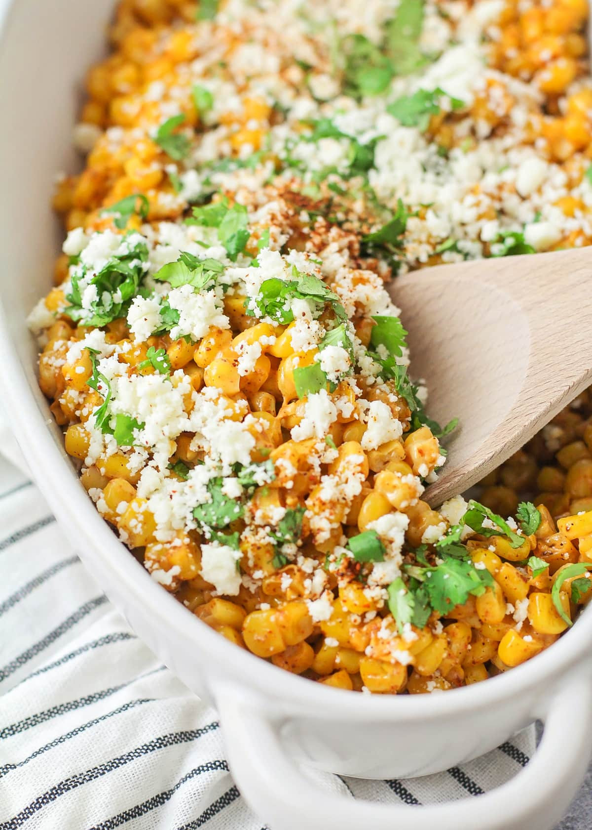 Mexican street corn recipe off the cob in a white bowl.