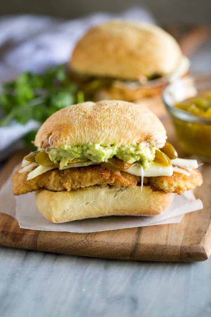 Mexican Torta sandwich with chicken , cheese, avocado and pickled jalapeno on a ciabatta roll.