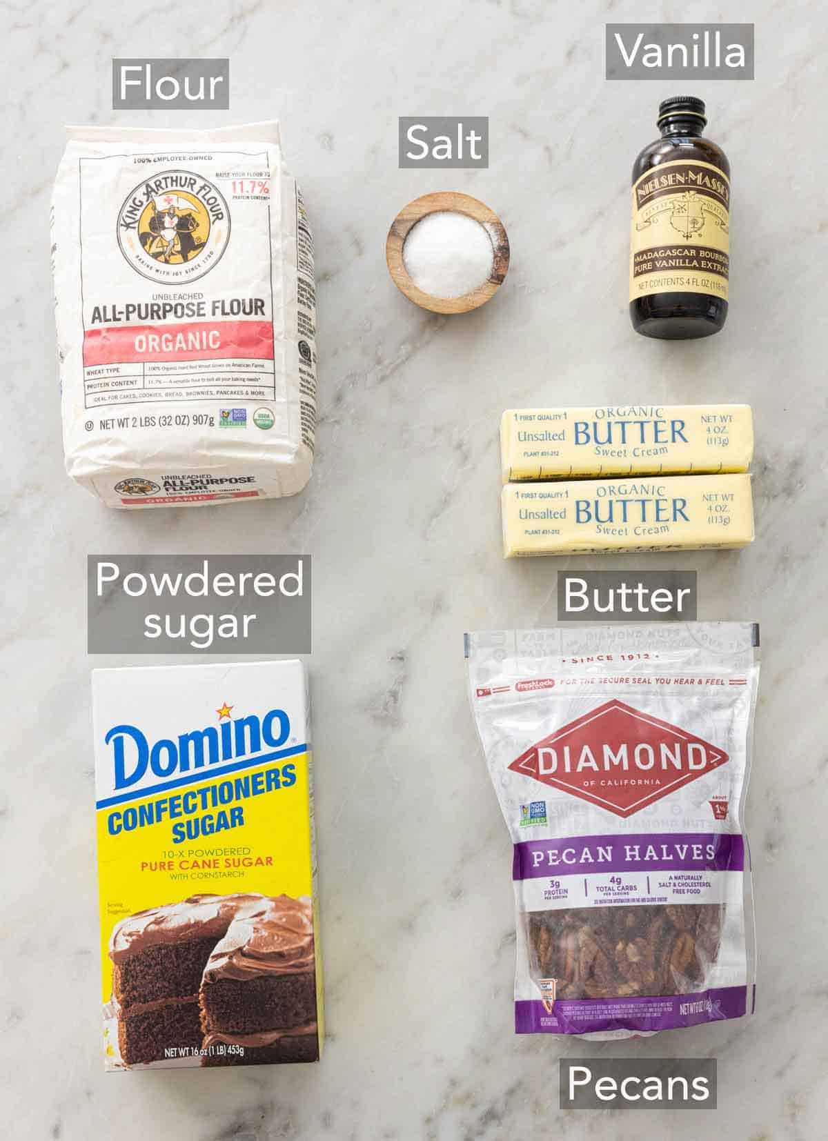 Ingredients for mexican wedding cookies laid out on a countertop.