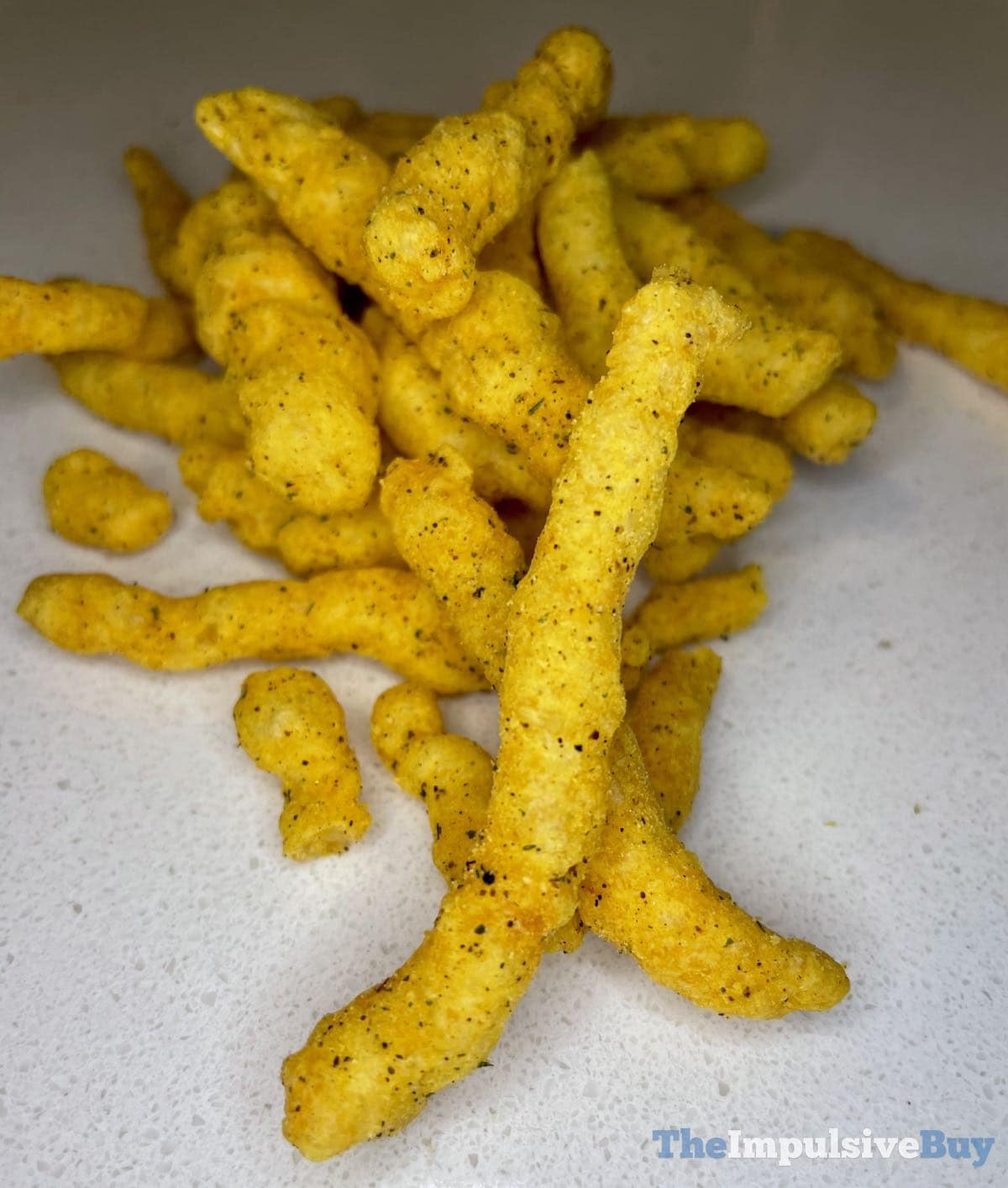 Detailed view of Mexican Street Corn Cheetos emphasizing seasoning and chip details