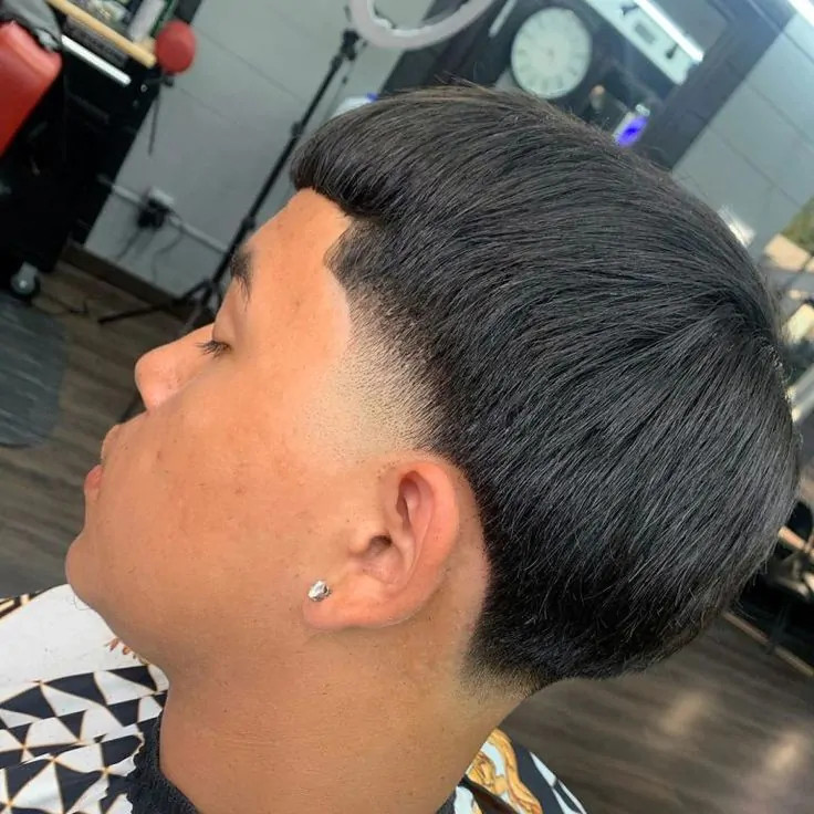 Mid Taper Edgar Hairstyle updating the classic cut with a higher taper