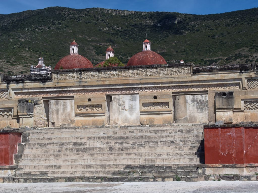Entrance to the Temple of Columns at Mitla, showcasing intricate geometric fretwork