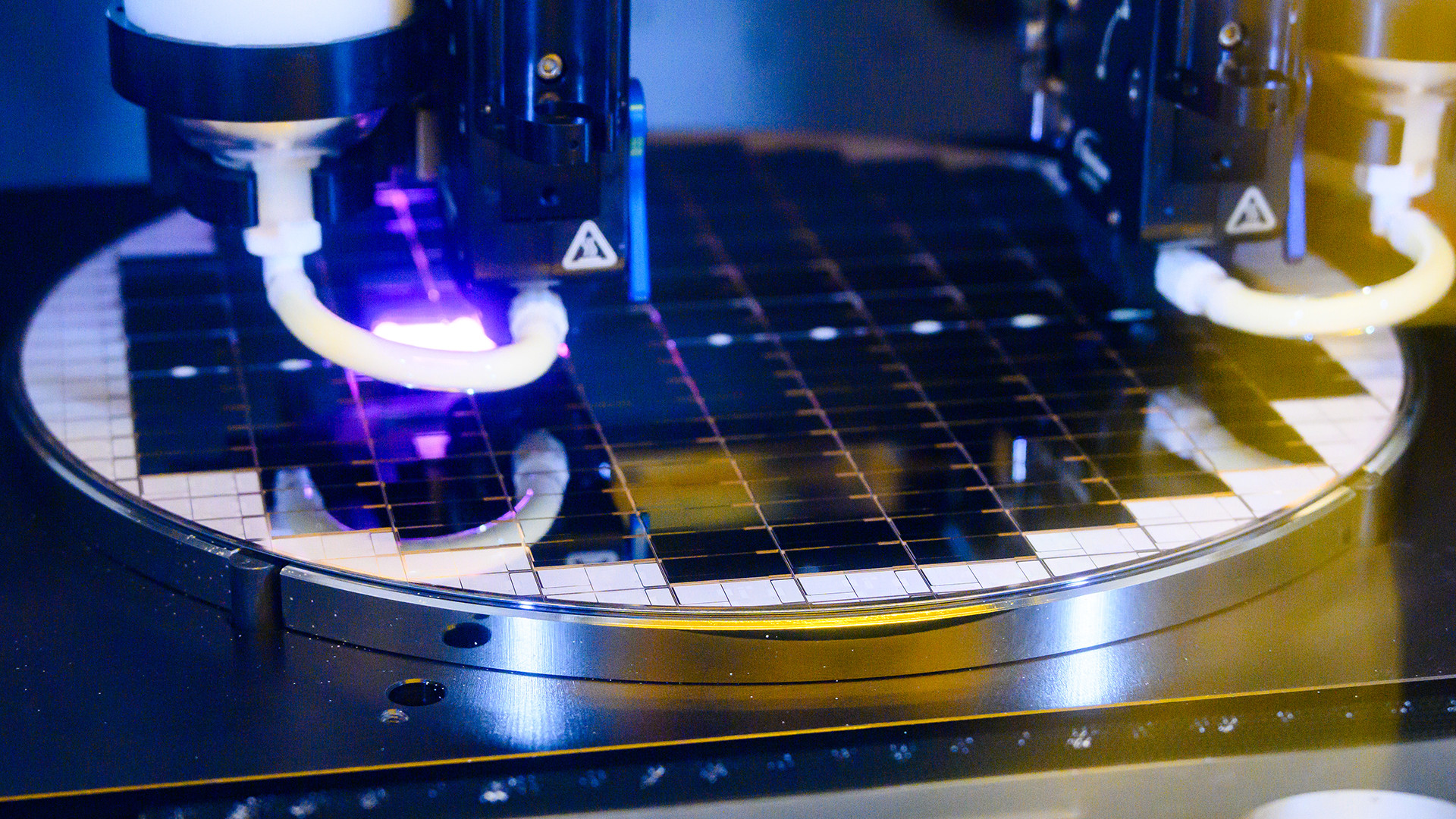 Close-up of chiplet bonding within advanced packaging technology Foveros at Intel's Fab 9, Rio Rancho, New Mexico, showcasing intricate processes and precision machinery.