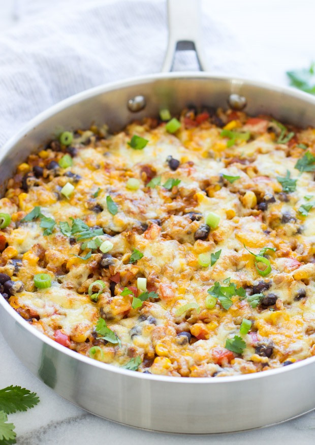 Golden brown and bubbly cheese topping a delicious One-Pan Mexican Rice Casserole, ready to be served.