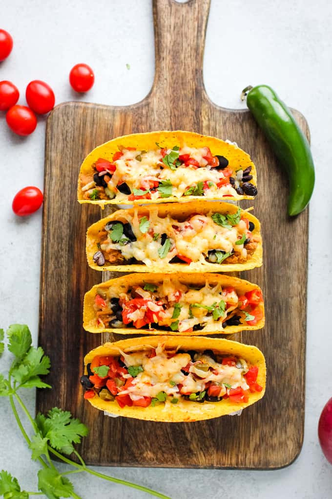 Oven-baked tacos, a perfect meal to serve with rice cooker Mexican rice, highlighting a delicious pairing for a complete Mexican-inspired dinner.