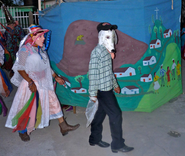Female clown and Perro characters showcasing dance boots