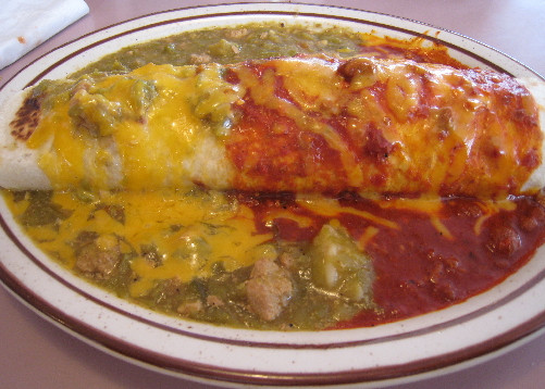 A breakfast burrito stuffed with chorizo, potatoes and egg.