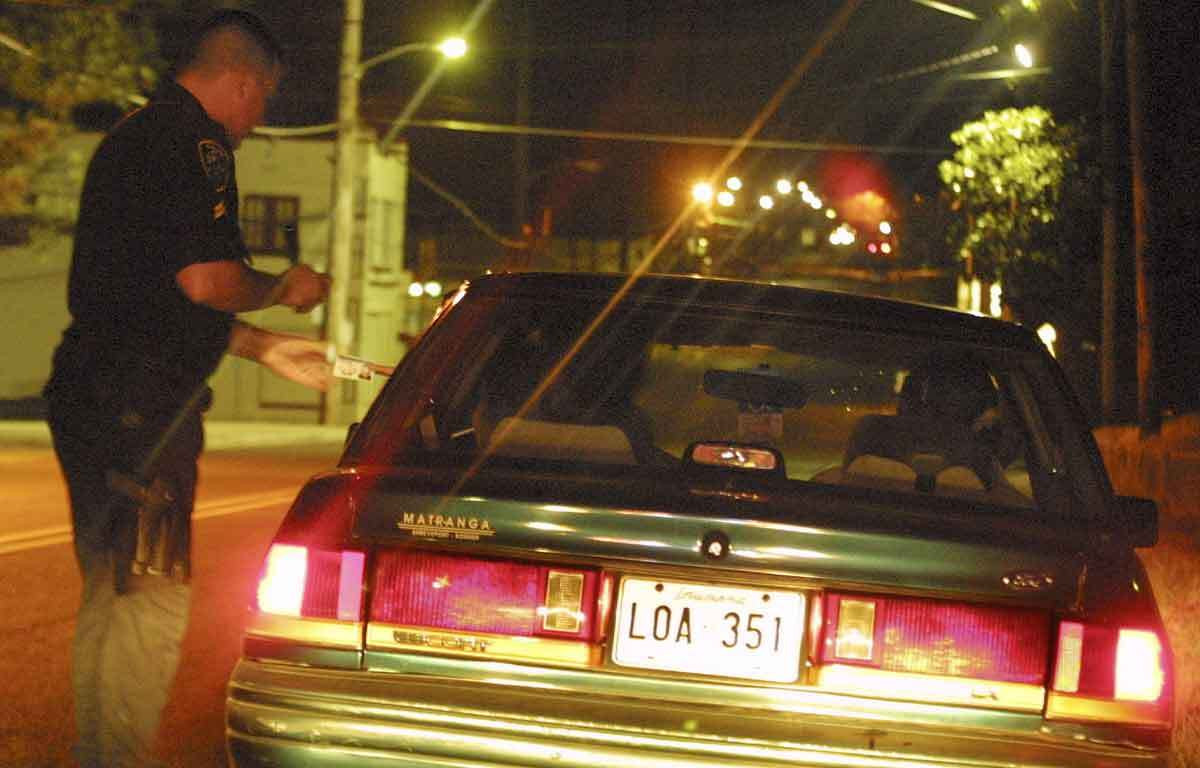 A generic police traffic stop image, representing the tense moments and uncertainties of police interactions while driving in Mexico.