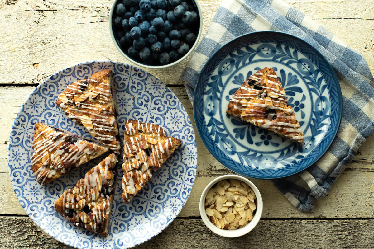 Delicious gluten-free blueberry-almond scones with lemon glaze recipe from St. James Tearoom.
