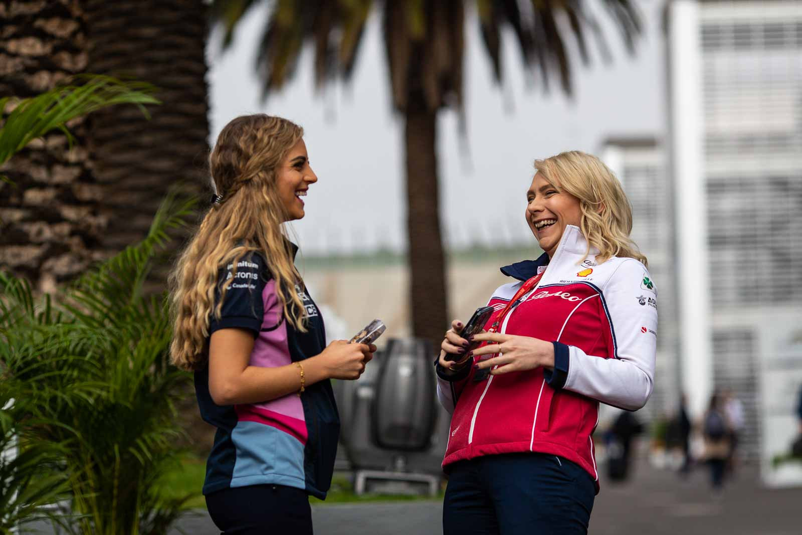 Carina from Racing Point and Ruth from Alfa Romeo chat in the paddock at the Mexican Grand Prix