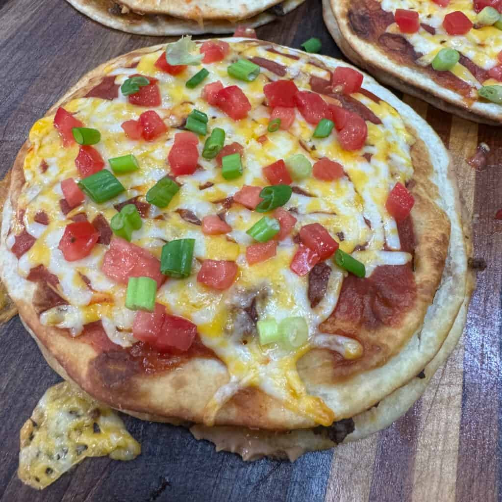 Skillet of seasoned ground beef and onions for Mexican Pizza