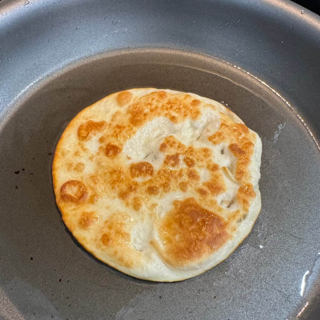 Frying flour tortillas for homemade Mexican Pizza