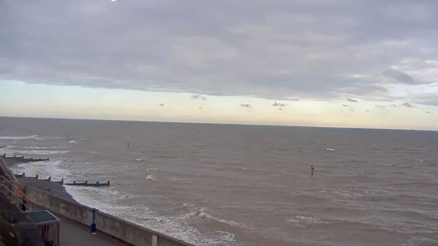 Expand your virtual travels: Sheringham Seafront webcam offers a different coastal view after experiencing Cancun beach live.