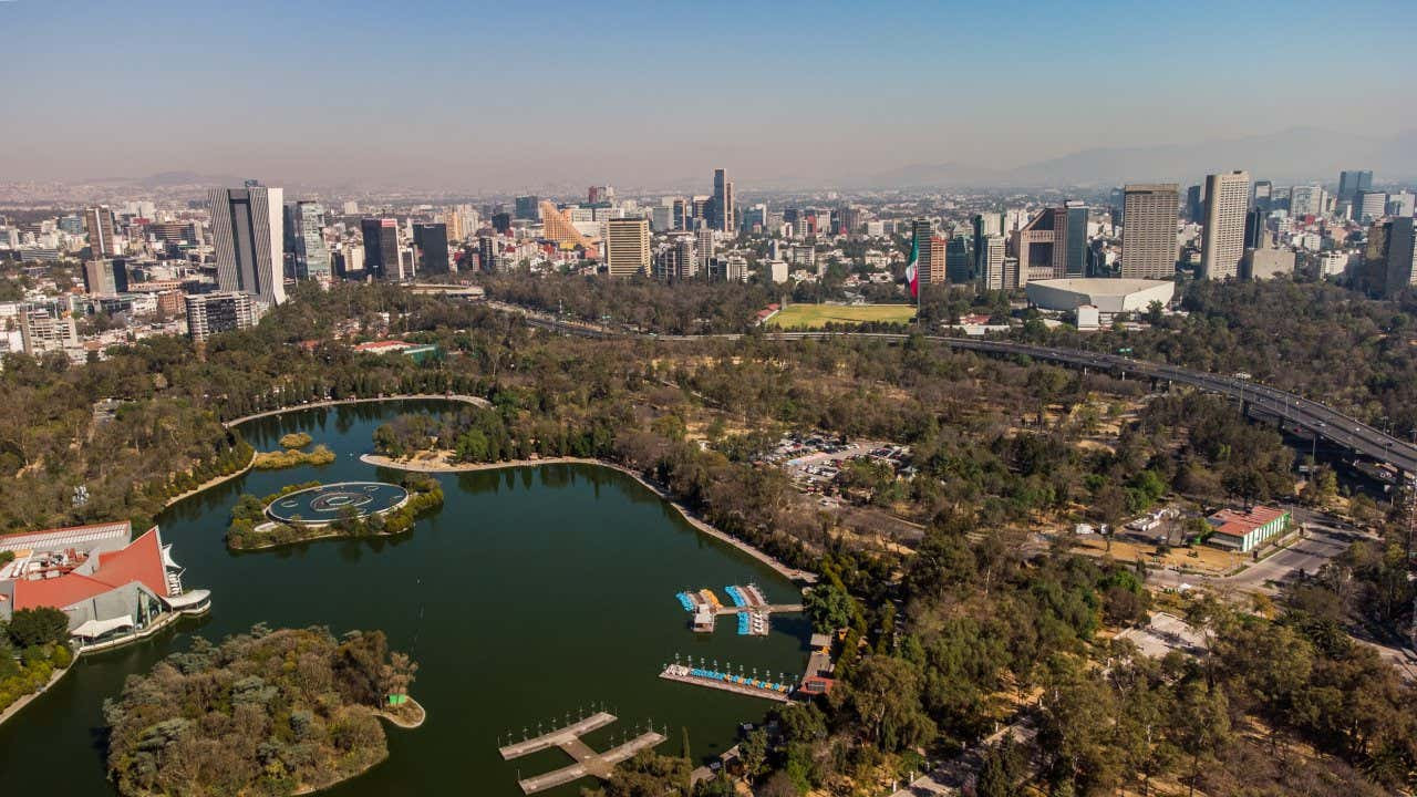 Expansive Chapultepec Park in Mexico City, a historical site with ruins dating back to the Mesoamerican period, offering green space and historical significance.