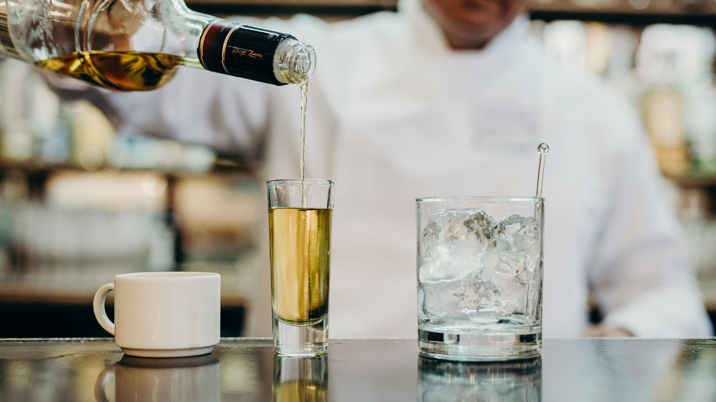 Carajillo coffee cocktail in Mexico City, featuring espresso and Licor 43 served over ice in a clear glass.