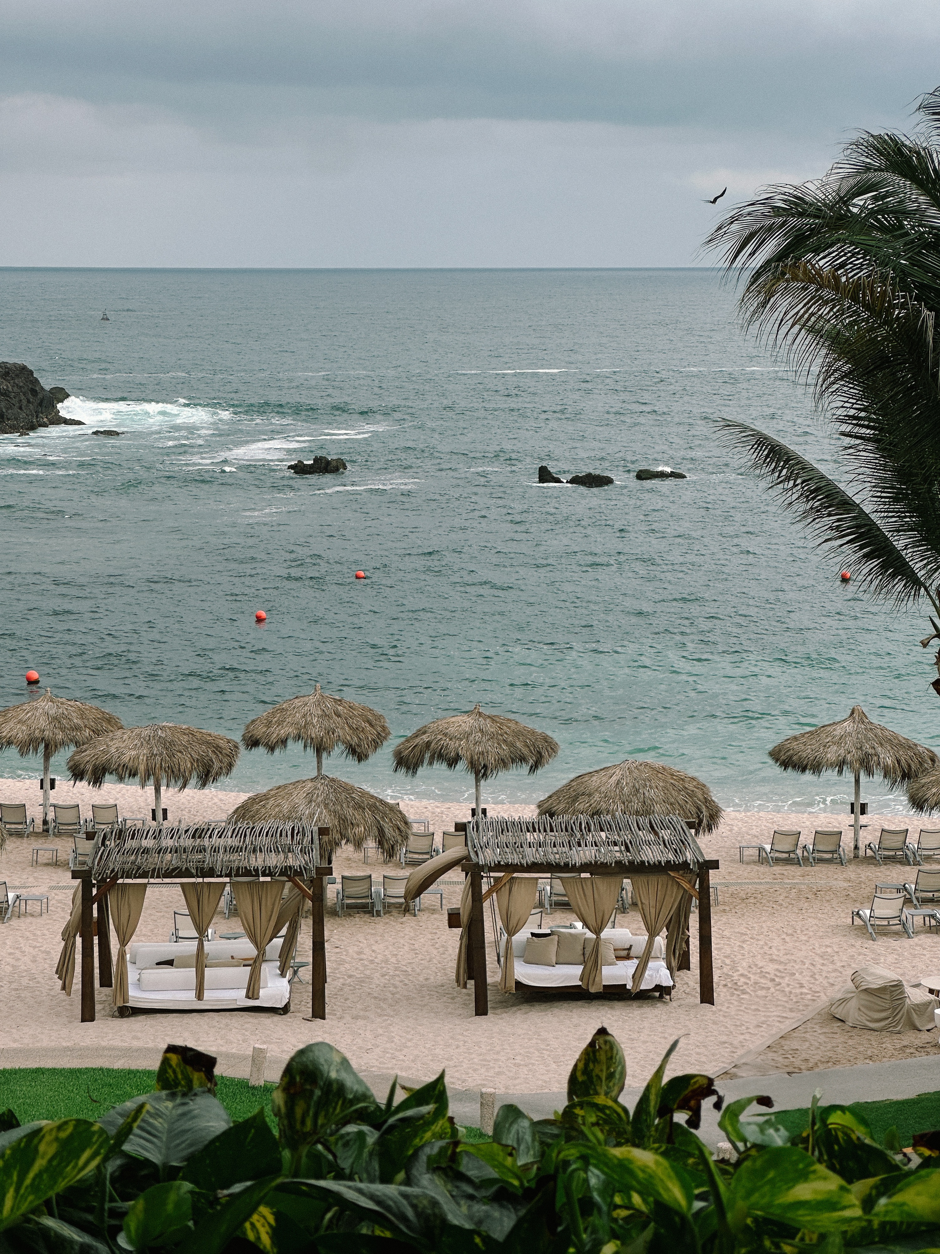 Beach cabanas lining the private beach at Four Seasons Resort Punta Mita