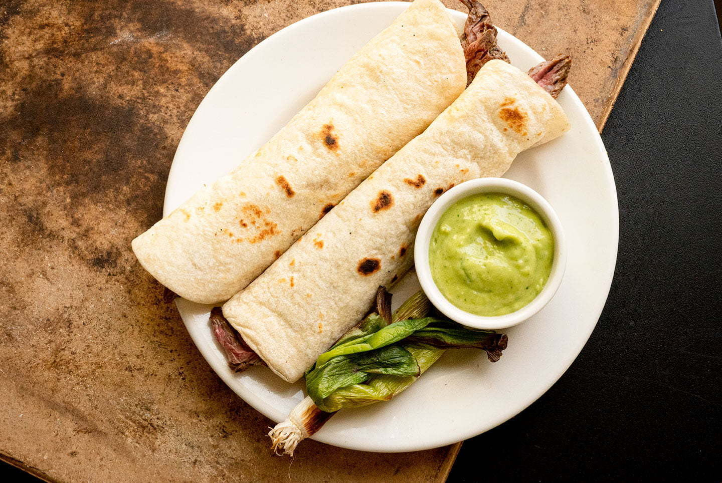 Sliced grilled steak ready to be served in tacos al carbon.