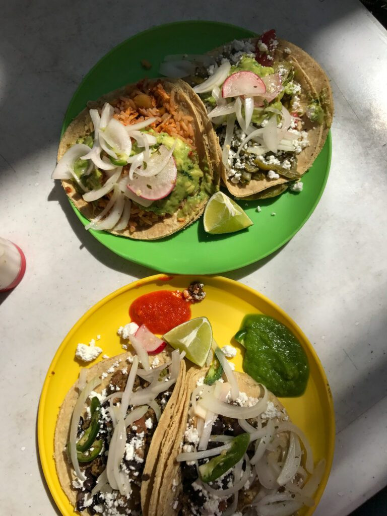 Tacos Hola with a counter display of various stews for tacos de guisado.